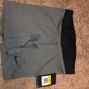 grey and black nike pros